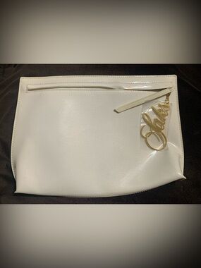 SAKS FIFTH AVENUE creme’ color patent leather Zip close accessory bag LNWOT